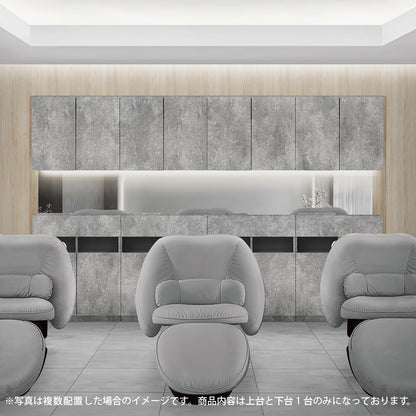 おしゃれな美容室のシャンプースペースにあるモルタルカラーのシャンプーキャビネット